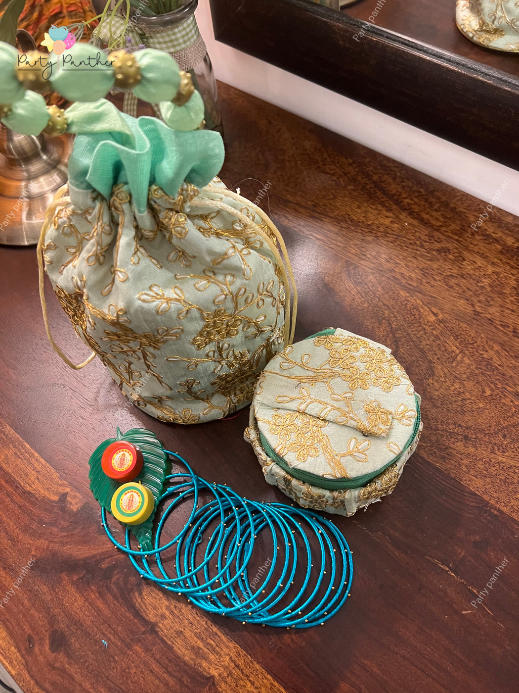 Return gift combo - Gorgeous Potli bags with Bangle Box, Bangles, Blouse bit, Kumkum and turmeric.
