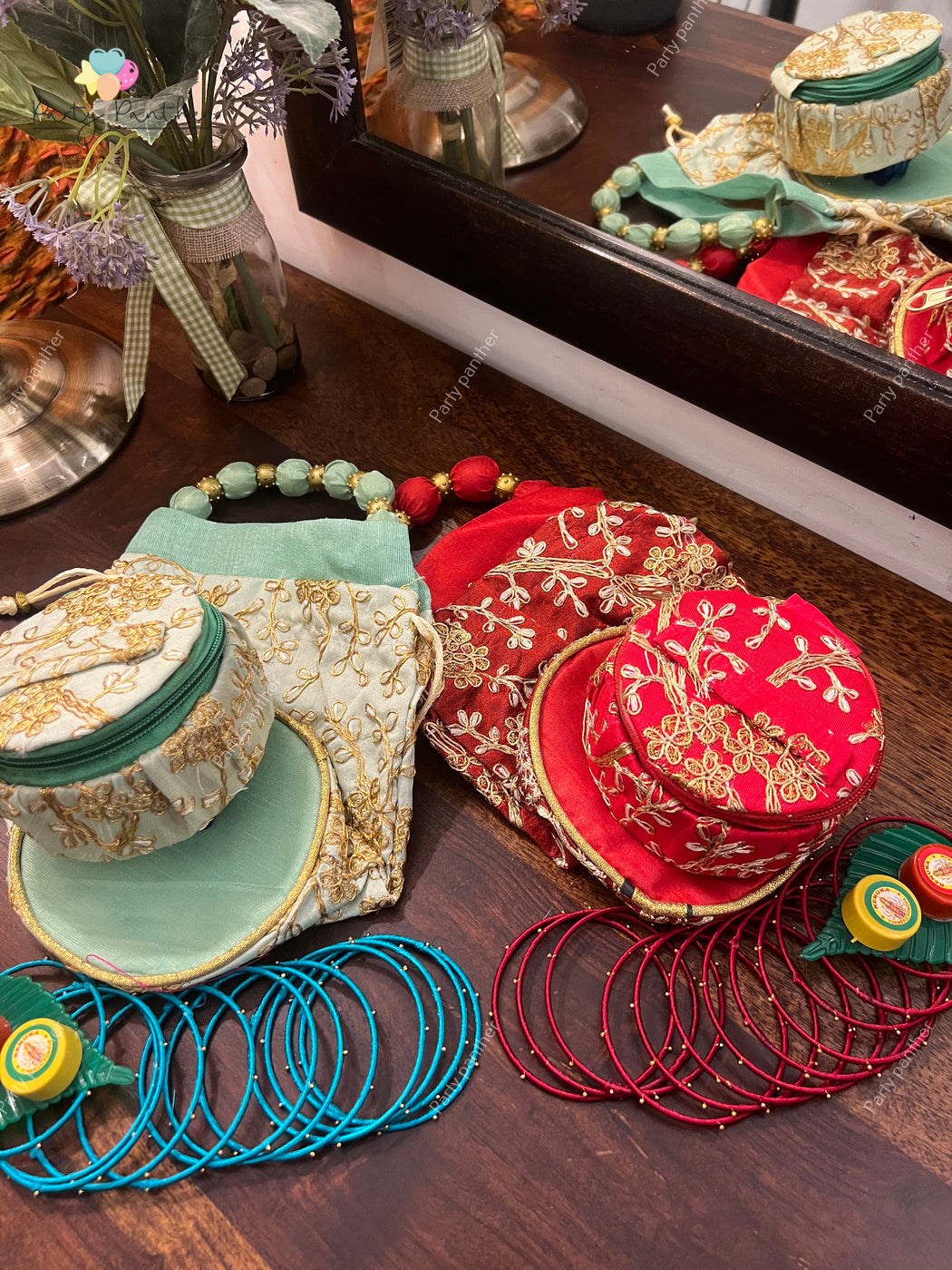 Return gift combo - Gorgeous Potli bags with Bangle Box, Bangles, Blouse bit, Kumkum and turmeric.