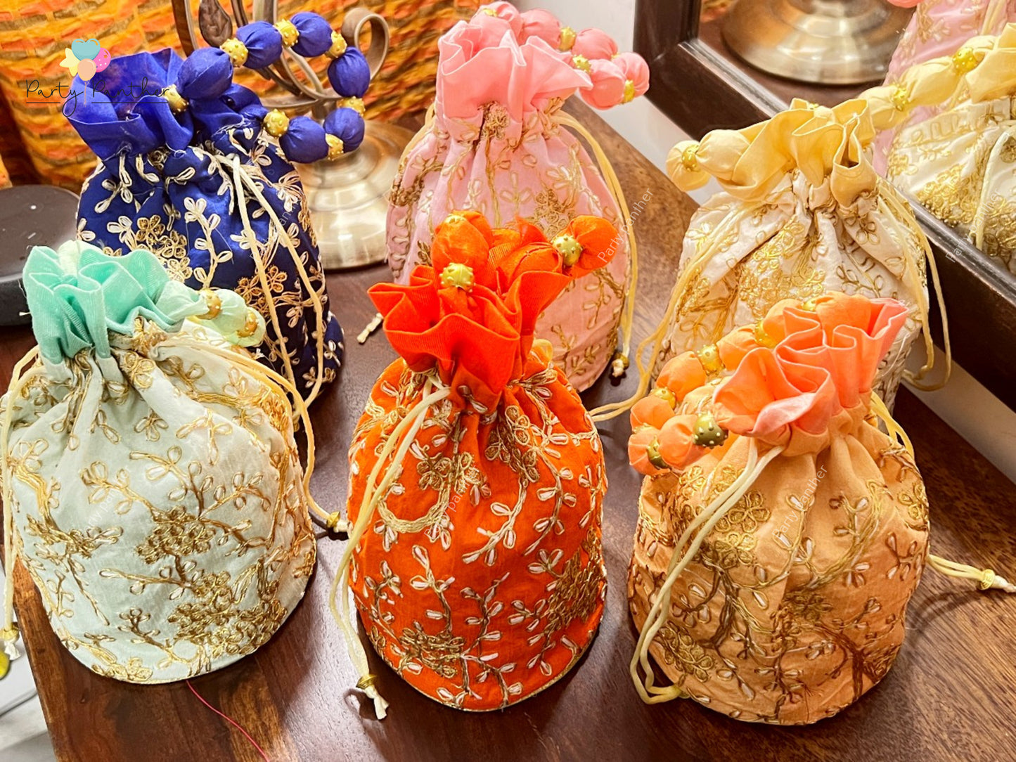 Return gift combo - Gorgeous Potli bags with Bangle Box, Bangles, Blouse bit, Kumkum and turmeric.