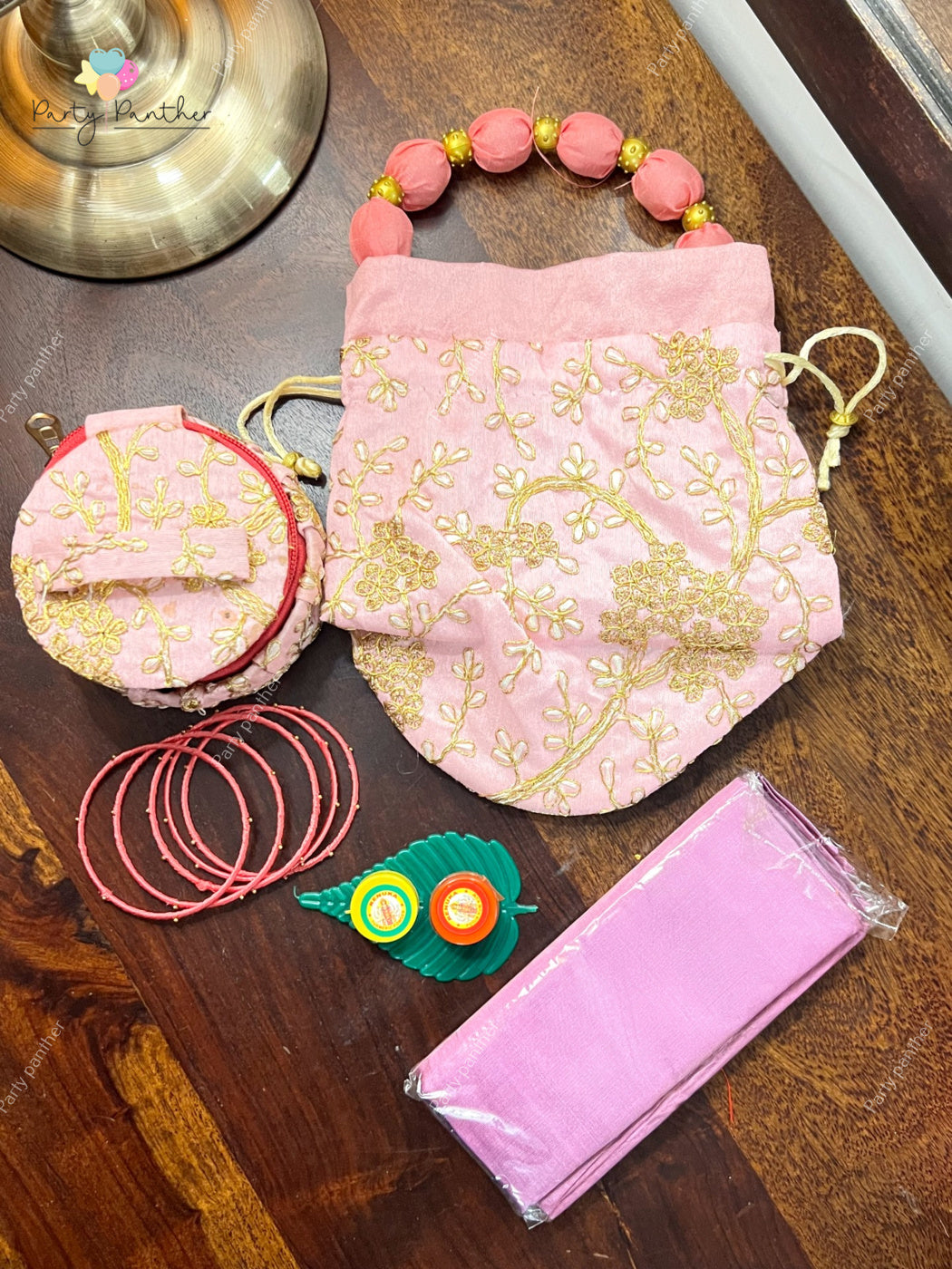 Return gift combo - Gorgeous Potli bags with Bangle Box, Bangles, Blouse bit, Kumkum and turmeric.