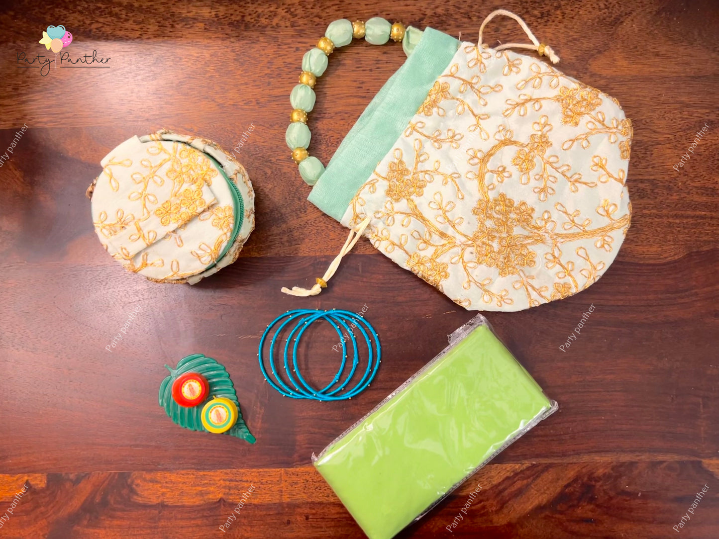 Return gift combo - Gorgeous Potli bags with Bangle Box, Bangles, Blouse bit, Kumkum and turmeric.