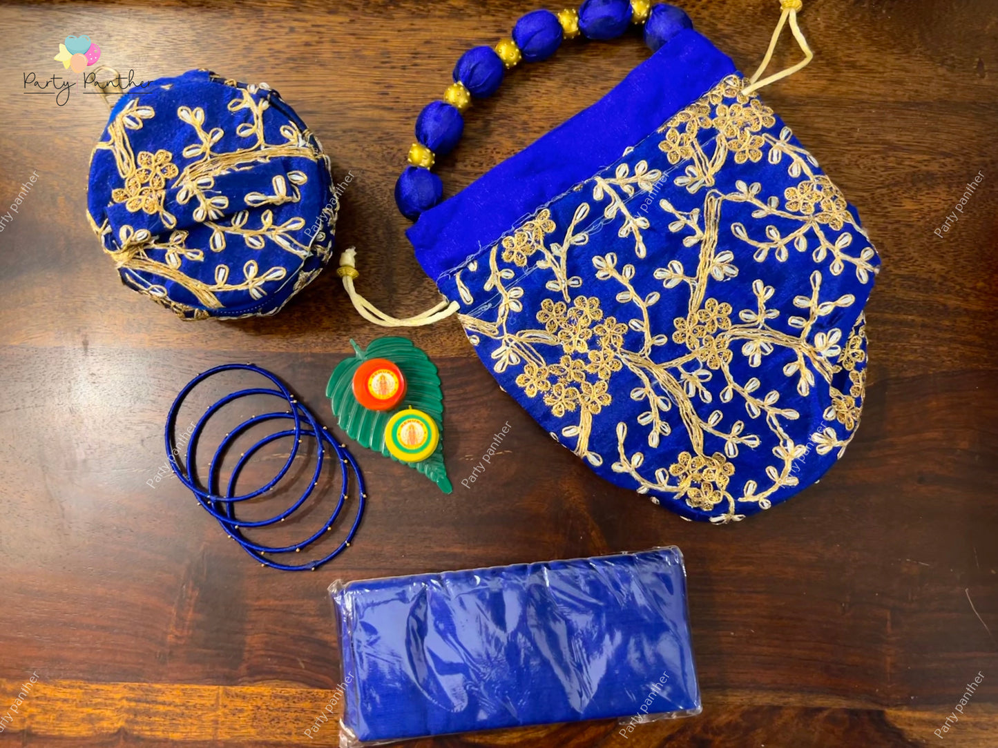 Return gift combo - Gorgeous Potli bags with Bangle Box, Bangles, Blouse bit, Kumkum and turmeric.